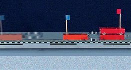 Xe đẩy của các khối lượng khác nhau nảy đi với một mùa xuân