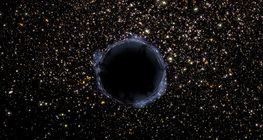 Một cụm hình cầu có một lỗ đen trong đó (nó đã được thêm vào kỹ thuật số vào ảnh)