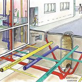 Csővezetékek és kábelek szövevénye az utcák aszfaltja alatt